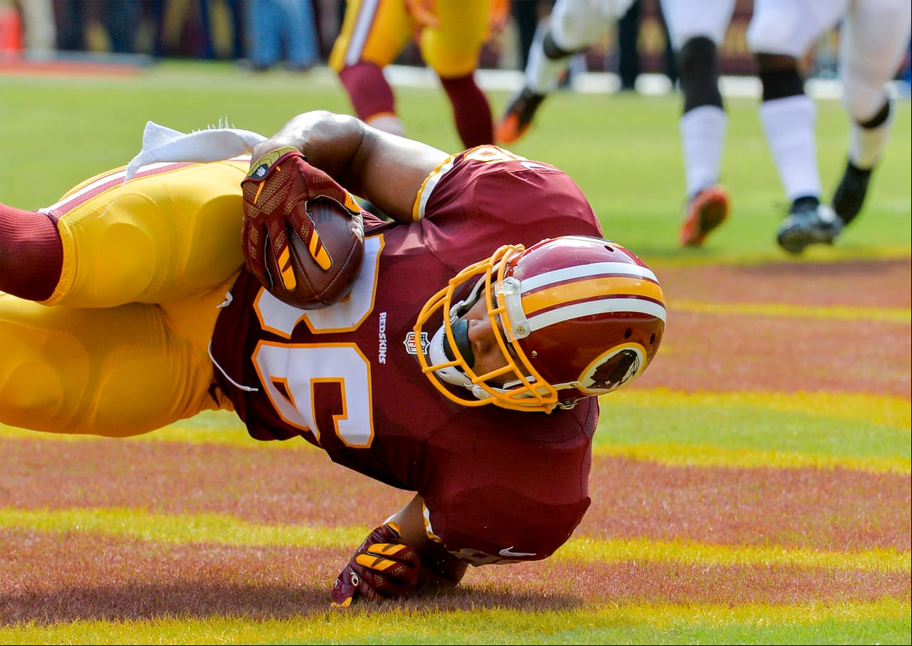 Washington Redskins tight end Jordan Reed (86) clutches the ball as he makes a diving touchdown reception during an NFL football game Sunday, October 2, 2016, in Landover, Maryland The Redskins defeated the Browns 31-20. (Doug Kapustin/AP Images for Panini)