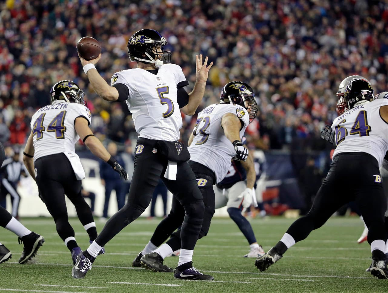 Baltimore Ravens quarterback Joe Flacco (5) es against the New England Patriots during the first half of an NFL football game, Monday, Dec. 12, 2016, in Foxborough, Mass. (AP Photo/Steven Senne)