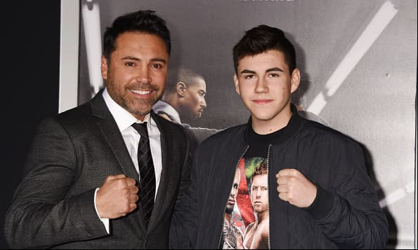 WESTWOOD, CA - NOVEMBER 19: Former professional boxer Oscar De La Hoya (L) and son Devon De La Hoya arrive at the premiere of Warner Bros. Pictures' 'Creed' at Regency Village Theatre on November 19, 2015 in Westwood, California.(Photo by Jeffrey Mayer/WireImage) *** Local caption *** Oscar De La Hoya; Devon De La Hoya