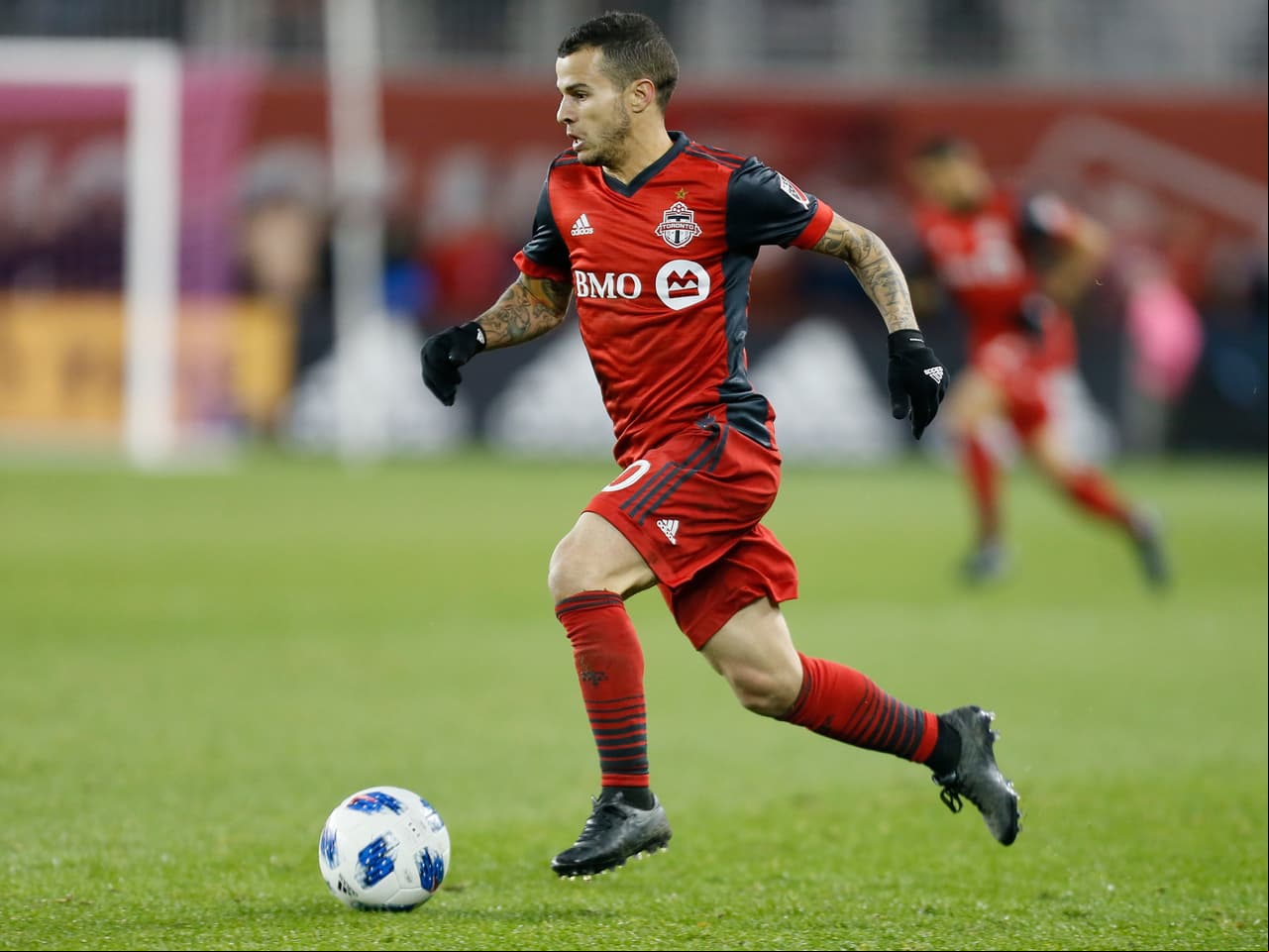 Oct 28, 2018; Toronto, Ontario, CAN; Toronto FC forward Sebastian Giovinco (10) dribbles the ball downfield against Atlanta United FC at BMO Field. Toronto defeated Atlanta 4-1. Mandatory Credit: John E. Sokolowski-USA TODAY Sports