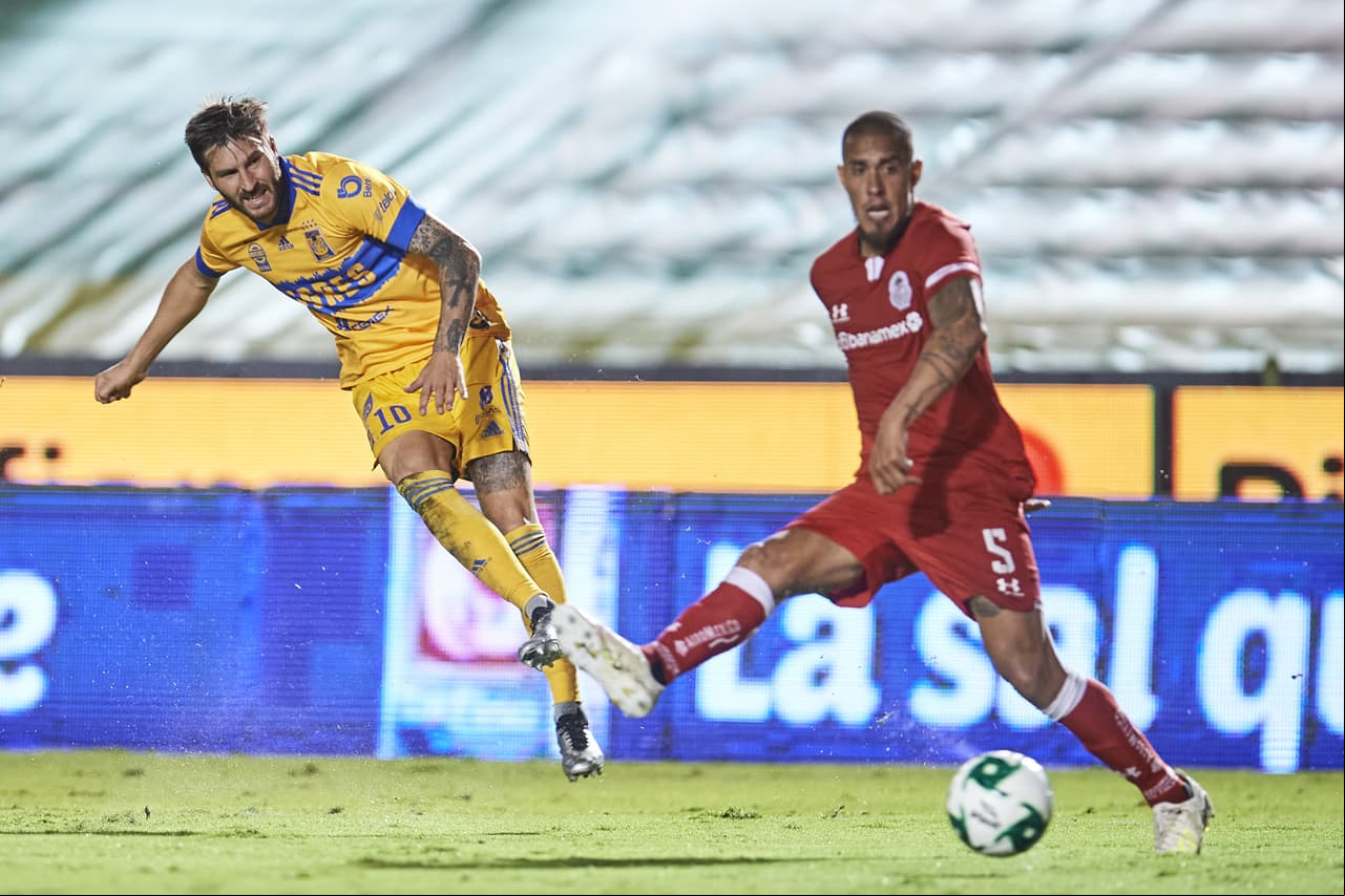 Con doblete de Andre Pierre Gignac, los Tigres sufren de más frente a los Diablos pero aseguran su lugar en la Liguilla del Guard1anes 2020.
