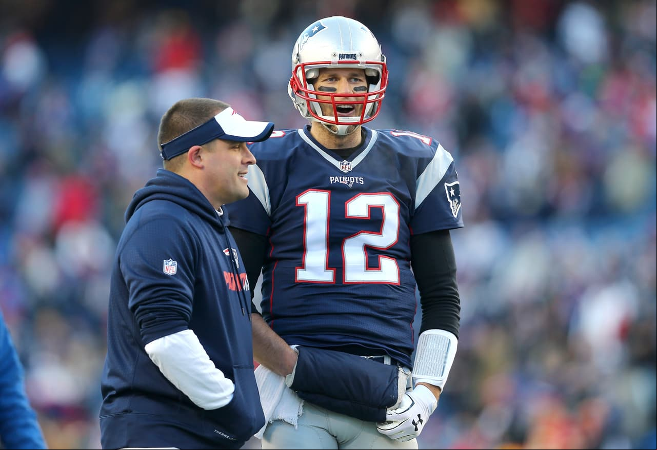 FOXBORO, MA - JANUARY 16: Tom Brady #12 of the New England Patriots looks on with offensive coordinator Josh McDaniels during warm ups prior to the AFC Divisional Playoff Game against the Kansas City Chiefs at Gillette Stadium on January 16, 2016 in Foxboro, Massachusetts. (Photo by Maddie Meyer/Getty Images)