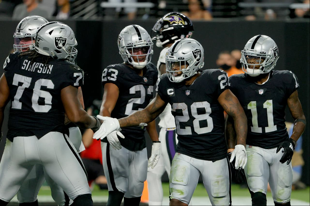 LAS VEGAS, NEVADA - SEPTEMBER 13: Josh Jacobs #28 of the Las Vegas Raiders celebrates with John Simpson #76 after scoring a touchdown against the Baltimore Ravens at Allegiant Stadium on September 13, 2021 in Las Vegas, Nevada. (Photo by Ethan Miller/Getty Images)