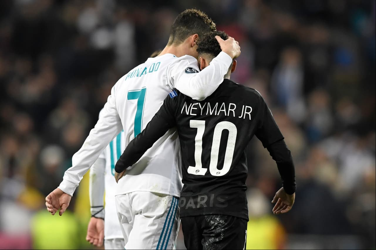 TOPSHOT - Real Madrid's Portuguese forward Cristiano Ronaldo (L) and Paris Saint-Germain's Brazilian forward Neymar leave the pitch at half-time during the UEFA Champions League round of sixteen first leg football match Real Madrid CF against Paris Saint-Germain (PSG) at the Santiago Bernabeu stadium in Madrid on February 14, 2018. / AFP PHOTO / GABRIEL BOUYS (Photo credit should read GABRIEL BOUYS/AFP/Getty Images)