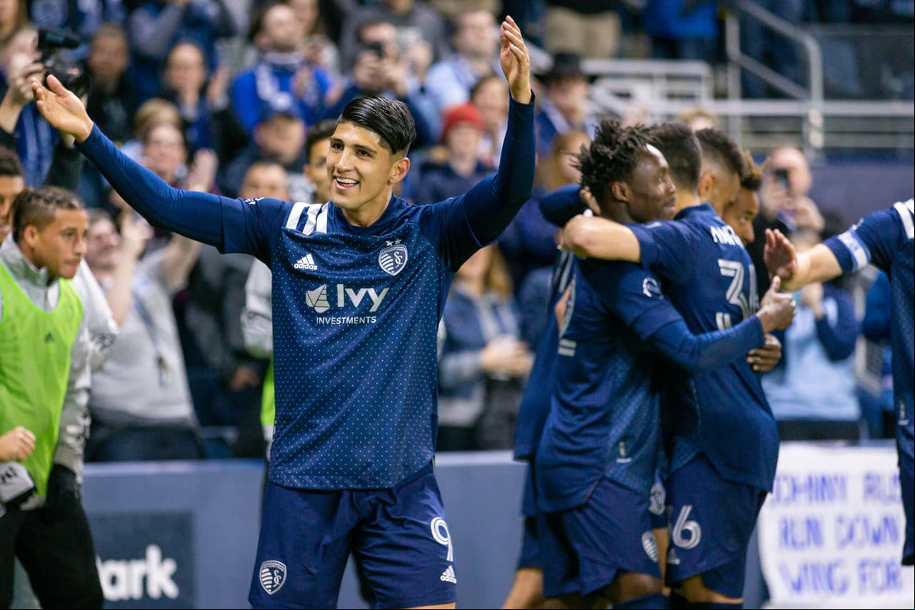 Mar 7, 2020; Kansas City, Kansas, USA; Sporting Kansas City forward Alan Pulido (9) celebrates after a goal during the second half against the Houston Dynamo at Children's Mercy Park. Mandatory Credit: William Purnell-USA TODAY Sports