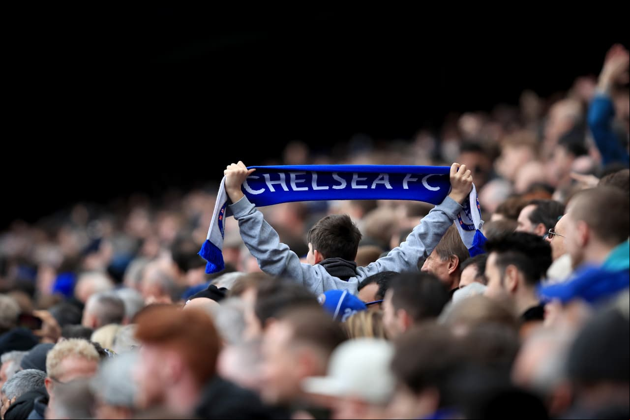 LONDON, ENGLAND - APRIL 01: A lone Chelsea fan holds aloft a scarf during the Premier League match between Chelsea and Tottenham Hotspur at Stamford Bridge on April 1, 2018 in London, England. (Photo by Marc Atkins/Offside/Getty Images)